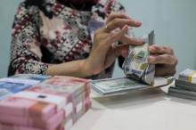 Rupiah Melemah ke Rp15.034 per Dolar AS, Investor Menunggu Kebijakan The Fed